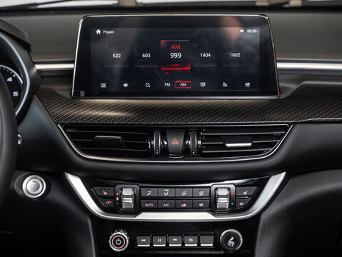 Novosibirsk, Russia - February  20 , 2024: Foton Tunland,  A close up on a  panel monitor with radio,  player , navigator and control buttons.