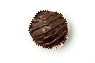 Chocolate muffin isolated on white background. Top view.
