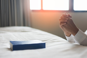 Woman with pray and worship god in her bedroom