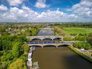The drone aerial view of  Richmond railway bridge over River Thames, with Twickenham bridge and...