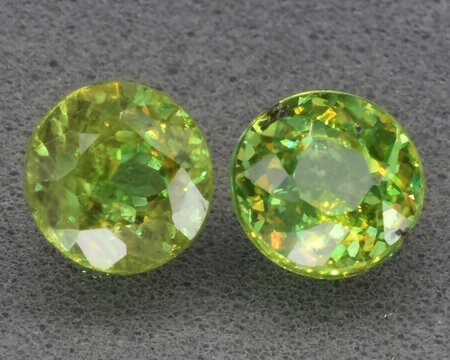 natural green sphene titanite gem on the background