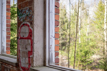 Broken windows in an abandoned factory