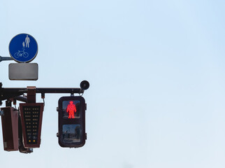 Street light at a pedestrian crossing. Traffic signal controlled pedestrian facilities.