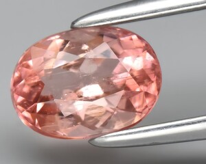 natural pink tourmaline gem on the background