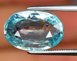 natural blue zircon gem on the background