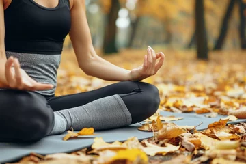 Poster Calm unrecognizable sporty Caucasian female lady girl woman fitness sportswear meditating lotus position zen gesture outside nature forest park. Yoga exercises meditation sport lifestyle mental health © Yuliia