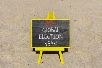 2024 global election year symbol. Concept words 2024 global election year on beautiful black chalk blackboard. Beautiful sand beach background. Business 2024 global election year concept. Copy space