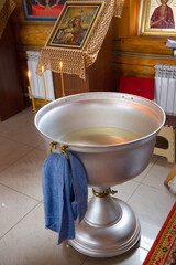 Baptismal font in the church for the baptism of a baby