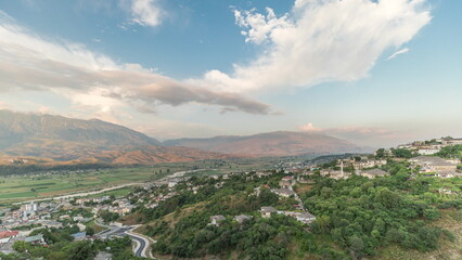 Obraz premium Panorama showing Gjirokastra city from the viewpoint of the fortress of the Ottoman castle of Gjirokaster timelapse.