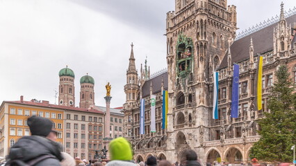 Music show on Clock Tower or Glockenspiel close-up, Detail of Rathaus New Town Hall with chime in...