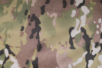 Texture of camouflage fabric as background, top view