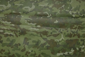Texture of camouflage fabric as background, top view