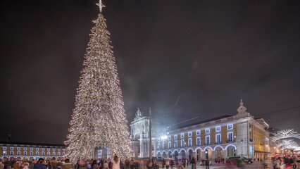Panorama showing Commerce square illuminated and decorated at Christmas time in Lisbon night timelapse. Portugal