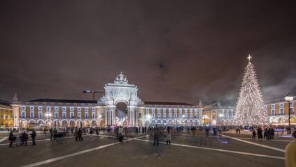 Fototapeta na wymiar Panorama showing Commerce square illuminated and decorated at Christmas time in Lisbon night timelapse. Portugal