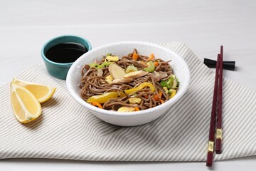 Stir-fry. Delicious cooked noodles with chicken and vegetables in bowl served on table