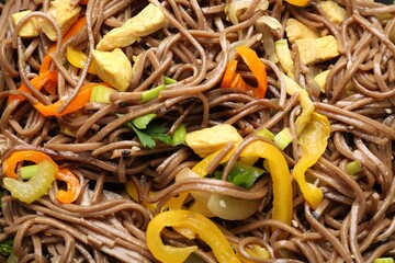 Stir-fry. Tasty noodles with vegetables and meat as background, closeup
