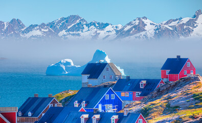Picturesque village on coast of Greenland - Colorful houses in Tasiilaq, East Greenland