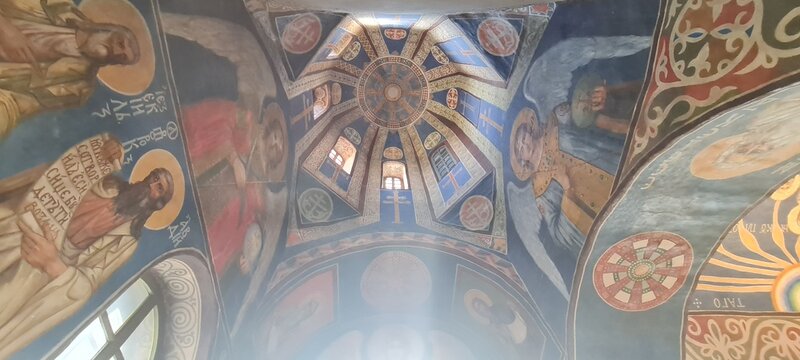 Ukrainian famous church of XII century. Cyril medieval church - today a museum. Scenic light in the dark. Heritage ancient and modern fresque on the walls.