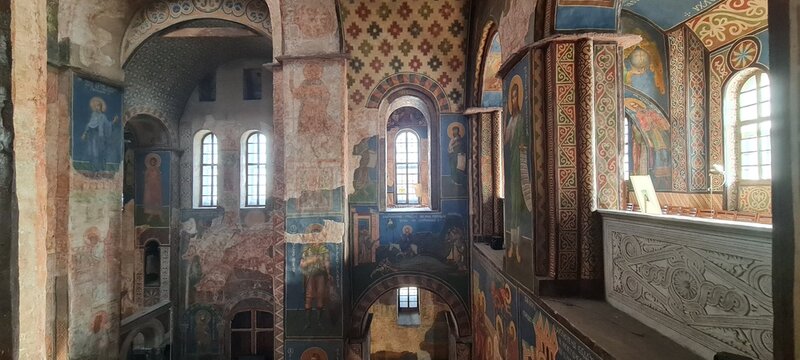 Ukrainian famous church of XII century. Cyril medieval church - today a museum. Scenic light in the dark. Heritage ancient and modern fresque on the walls.
