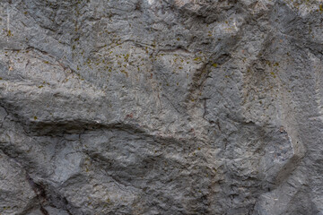Close-up view of abstract rough dark gray stone rock background. Copy space for your text or decoraton. Natural textured backgrounds theme.