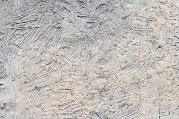 Close-up view of abstract rough gray stone (or concrete wall) surface background. Surface covered with lines and scratches. Copy space for your text or decoraton. Backdrop template theme.