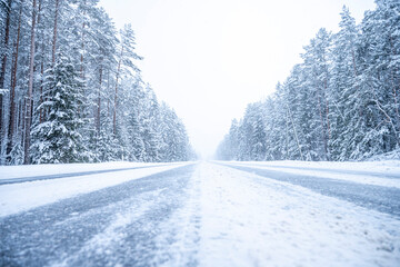 Winter road in the forest. Winter landscape with snow covered trees.