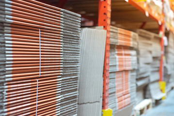 Hardware store full of folded moving boxes cardboard case on shelves rack, moving and storage...