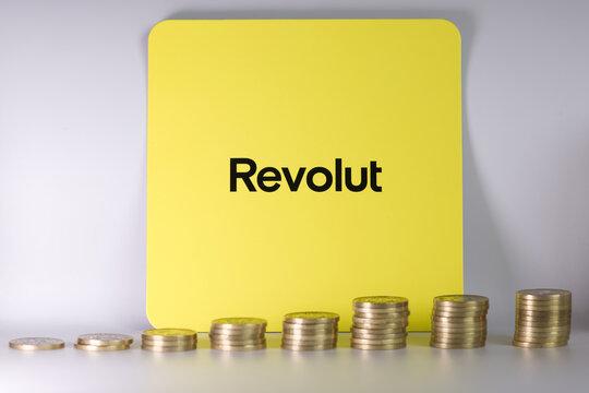 Pile of conis placed on vibrant background with Revolute sing. 