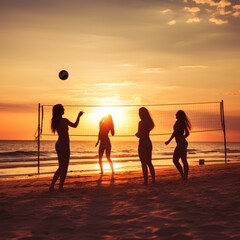 Friends playing volleyball on beach at sunset