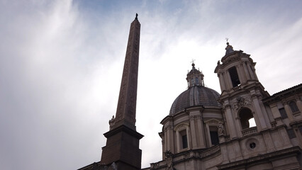 The Fountain of the Four Rivers with the Obelisco Agonale and the Church of Sant'Agnese in Agone viewed from Piazza Navona.