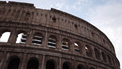Fototapeta premium Superposed order of the Colosseum in Rome, Italy. The ancient Roman Colosseum is one of the main tourist attractions in Europe.