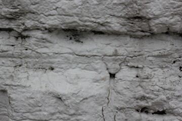 old cracked stone wall