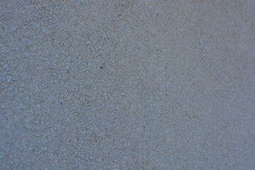 Concrete wall with sharp gray stones and gray cement