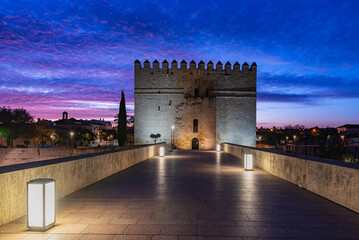 Torre de la Calahorra at dawn at one end of the Roman bridge of Cordoba, currently the Living...