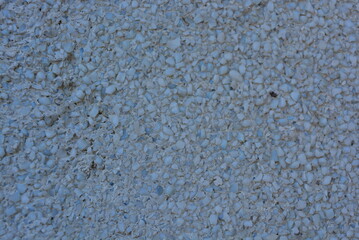 Old cement with a matte gray glass crumb in the shade