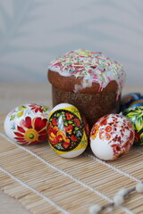 Easter, brightly colored Easter eggs and Easter cake. Celebration traditions