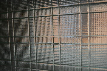 Glass dented background in the form of square wafers, squares and direct reliefs - obrazy, fototapety, plakaty