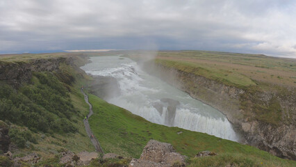 Gullfoss ("Golden Falls") is a waterfall located in the canyon of the Hvítá River in southwest Iceland. The rock of the river bed was formed during an interglacial period.