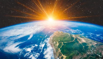 Poster view of blue planet earth with sun rising from space elements of this image furnished by nasa © Kira