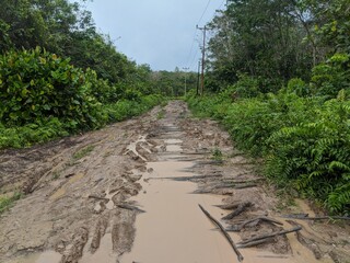 Fototapeta na wymiar The dirt road was damaged due to heavy rainfall