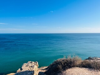 Blue ocean horizon, rocky coast, ocean bay