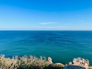 Blue ocean horizon, rocky coast, ocean bay