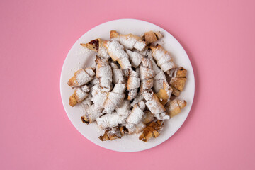 Homemade Vitushki Cookies on a Round Plate with Pink Background  with Copy Space