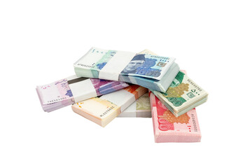 Heap of Pakistani currency bundles on white isolated background