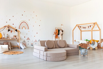 Kids room interior in contemporary, Scandinavian style. Wooden bed, sofa and toys. Cozy room for child. - 749983055