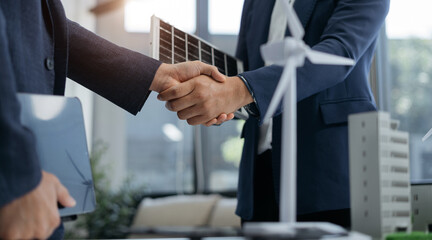 Businessmen shake hands after agreeing to start a new project successfully