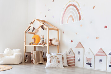 Kids room interior in contemporary, Scandinavian style. Wooden bed, sofa and toys. Cozy room for child. - 749983264