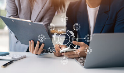 Zero trust security concept Person using computer and tablet with zero trust icon on virtual screen...