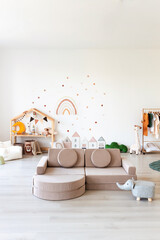 Kids room interior in contemporary, Scandinavian style. Wooden bed, sofa and toys. Cozy room for child. - 749983815