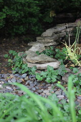 A pile of natural rocks in the summer garden.